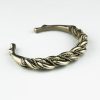 Twisted bracelet with animal heads
